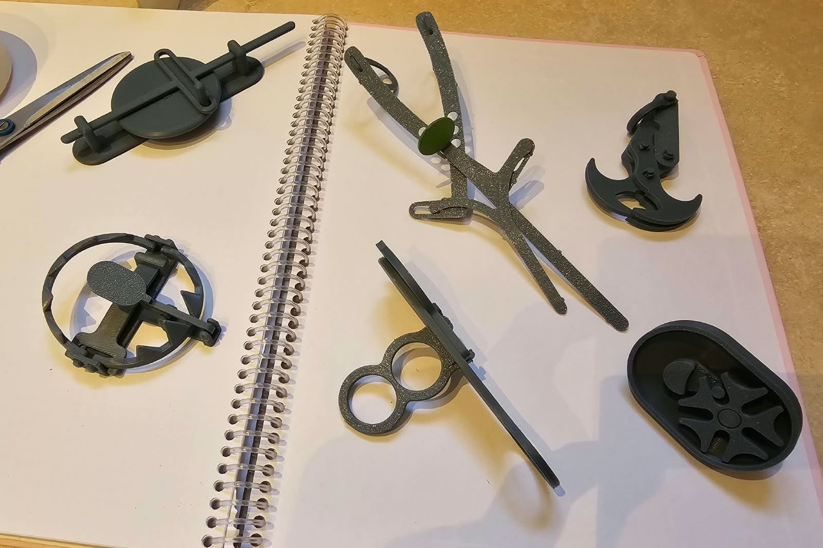 Game prototypes arranged on an open notebook
